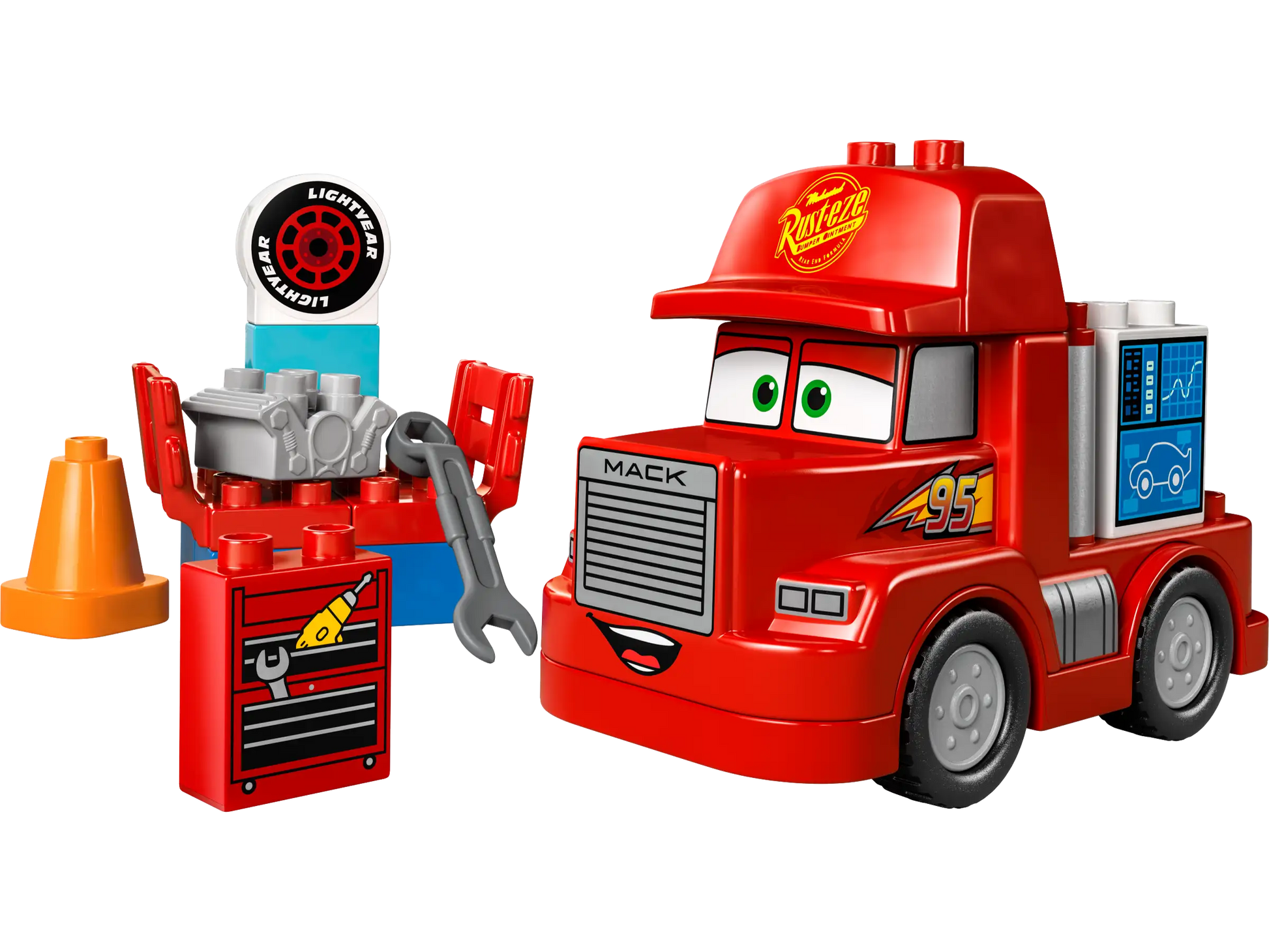 The LEGO® DUPLO® Mack at the Race by Legos - Toyhouse is a red truck with cartoon eyes, “95” and “Rust-eze” decals, plus accessories like a toolbox, cone, engine, tire, and wrench—just like in the Disney Pixar Cars movie.