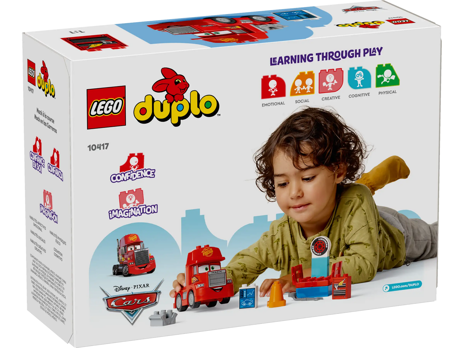 A child plays with the LEGO® DUPLO® Mack at the Race set from Legos - Toyhouse; the box shows toy pieces and highlights benefits like building confidence and sparking imagination.