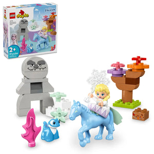 The LEGO® DUPLO® Elsa & Bruni in the Enchanted Forest set by Legos - Toyhouse features Elsa riding a blue horse, Bruni, a rock figure, trees, colorful pieces, and themed packaging in the background.