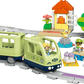 The LEGO® DUPLO® Interactive Adventure Train by Legos - Toyhouse includes two figures, a dog, a small house, trees, and colorful accessories on a curved gray track—an ideal train set for toddlers.