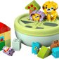 The LEGO® DUPLO® Shape Sorter: Puppy House by Legos - Toyhouse features colorful building blocks with animal faces and designs, arranged around a round shape sorter to encourage fine motor skills.
