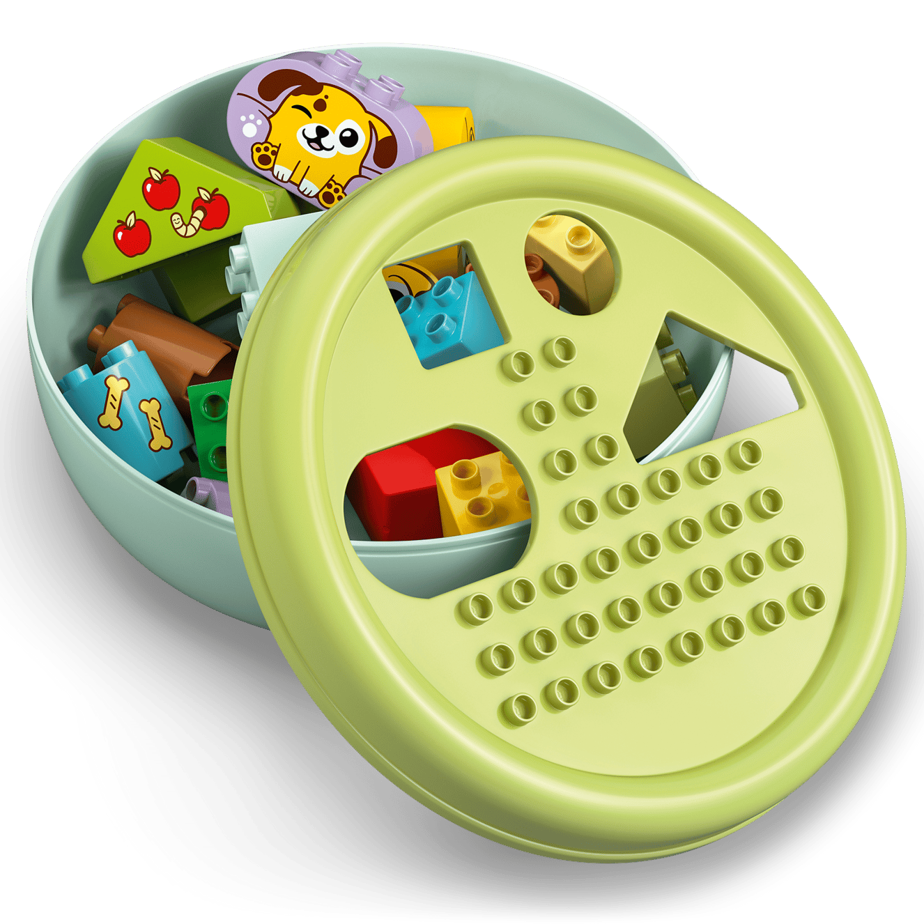 The LEGO® DUPLO® Shape Sorter: Puppy House by Legos - Toyhouse is a round, light green container with colorful blocks, including puppy, bone, and apple designs—ideal for developing fine motor skills in young children.