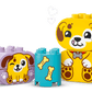 The LEGO® DUPLO® Shape Sorter: Puppy House by Legos - Toyhouse features cartoon puppy blocks and a blue bone-illustrated block, all set against a white background with hearts—a charming fine motor skills toy for toddlers.