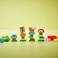 Legos - Toyhouse LEGO® DUPLO® Creative Garden & Flowers features colorful blocks built into flower and animal shapes numbered 1 to 4, making it an ideal preschool learning toy on a bright yellow surface.