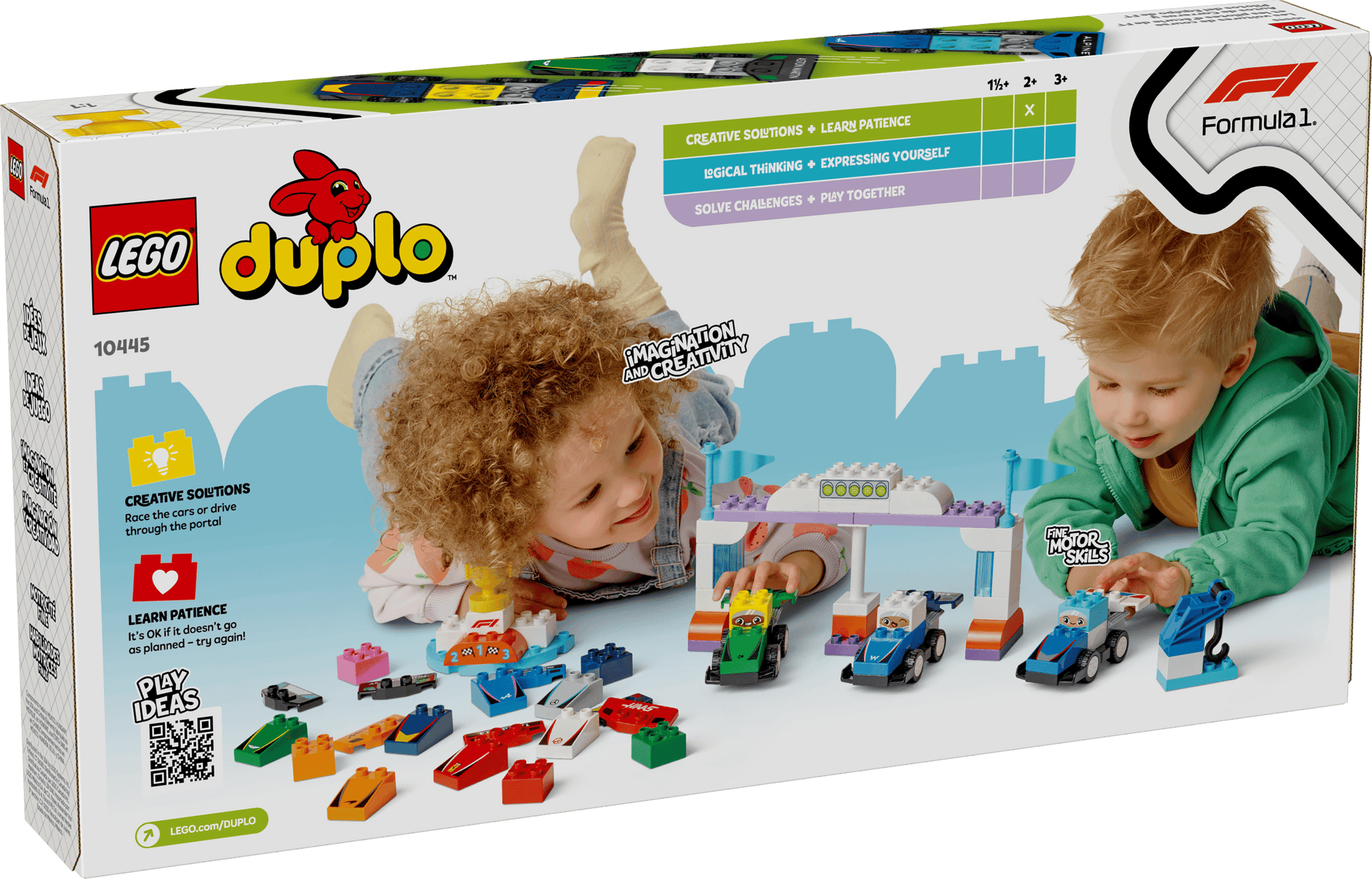 Two children play with the LEGO® DUPLO® F1® Team Race Cars & Drivers by Legos - Toyhouse, surrounded by colorful blocks—an exciting Formula 1 building set that’s also a great learning toy for toddlers.