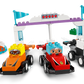 Three LEGO® DUPLO® F1® Team Race Cars & Drivers by Legos - Toyhouse, featuring colorful cars, drivers with cartoon faces, blocks, a trophy, and race accessories—perfect as an F1 race car and learning toy for toddlers.