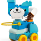 The LEGO® DUPLO® 3in1 Animals on Wheels by Legos - Toyhouse features a blue and white cat with yellow wheels, a hula hoop, and a smiling face—ideal for toddlers or animal-on-wheels fans.