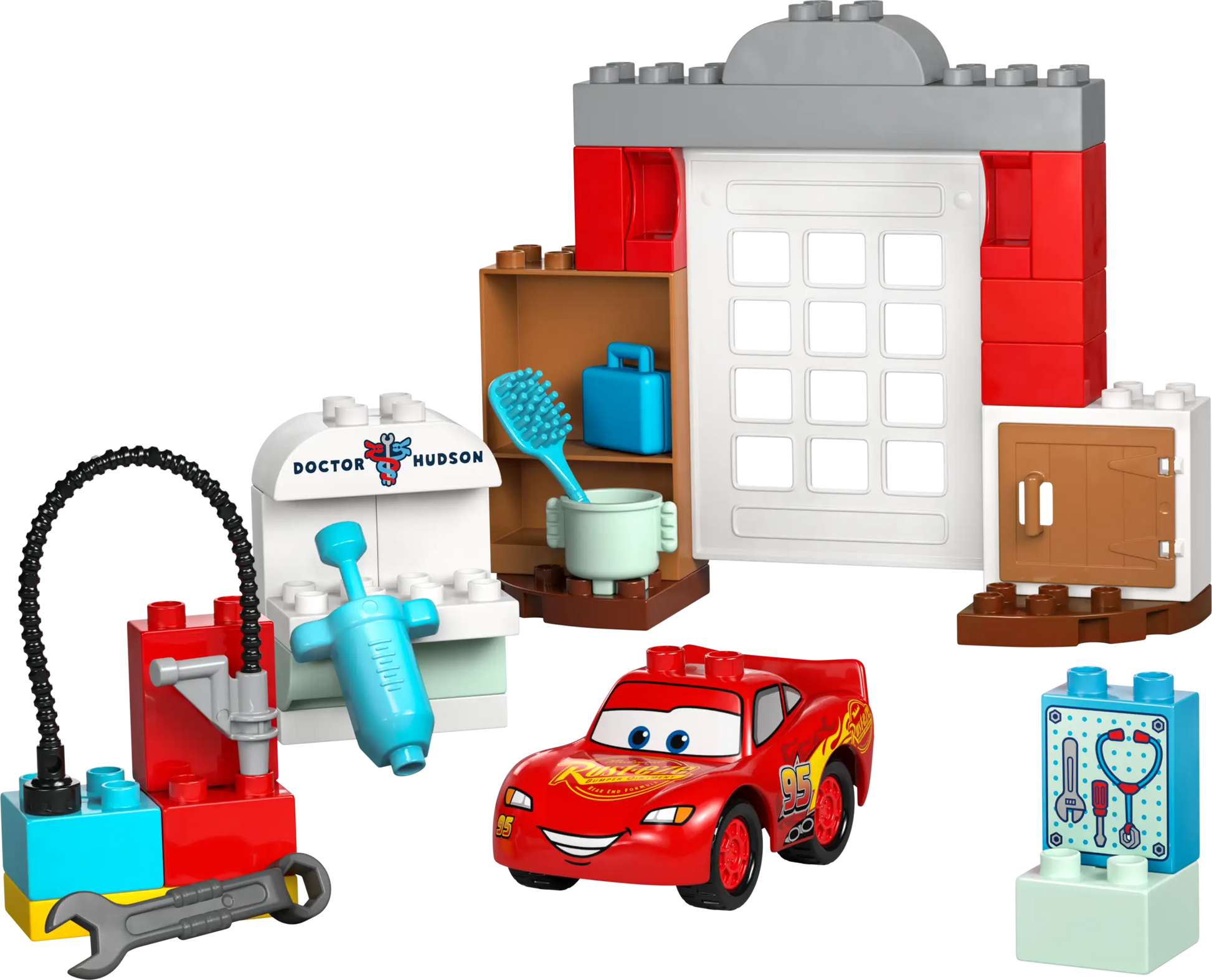 LEGO® DUPLO® McQueen's Visit to Doc's Garage by Legos - Toyhouse features a buildable race car, blocks, tools, a sink, shelves, and a “Doctor Hudson” wall—ideal for toddlers who love car repair and creative play.