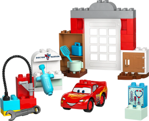 LEGO® DUPLO® McQueen's Visit to Doc's Garage by Legos - Toyhouse features a buildable race car, blocks, tools, a sink, shelves, and a “Doctor Hudson” wall—ideal for toddlers who love car repair and creative play.