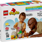 A young child and an adult enjoy building with the LEGO® DUPLO® Disney™ Winnie the Pooh's Birthday Party set by Legos - Toyhouse; the box shows blocks, character figures, and product details for this educational toy.