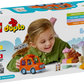 A child enjoys the LEGO® Ice Cream Trip with Bluey by Legos - Toyhouse, featuring a toy car, figures, and food stand. The box highlights imagination and motor skills, making it a perfect toddler toy.