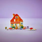 The LEGO® DUPLO® Bluey's Family House with Memory Game by Legos - Toyhouse features colorful interlocking bricks, mini figures, and accessories against a purple background, creating an interactive play scene for imaginative fun.