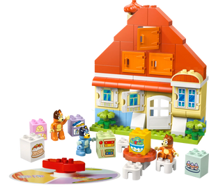 The LEGO® DUPLO® Bluey's Family House with Memory Game by Legos - Toyhouse features four cartoon animal figures, large printed blocks, and a round disc for a fun memory game, all on a white background.