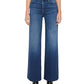 Wearing Mother’s The Hustler Roller Sneak high-rise wide leg jeans crafted from stretch denim and paired with black pointed-toe boots, the person stands against a plain background.