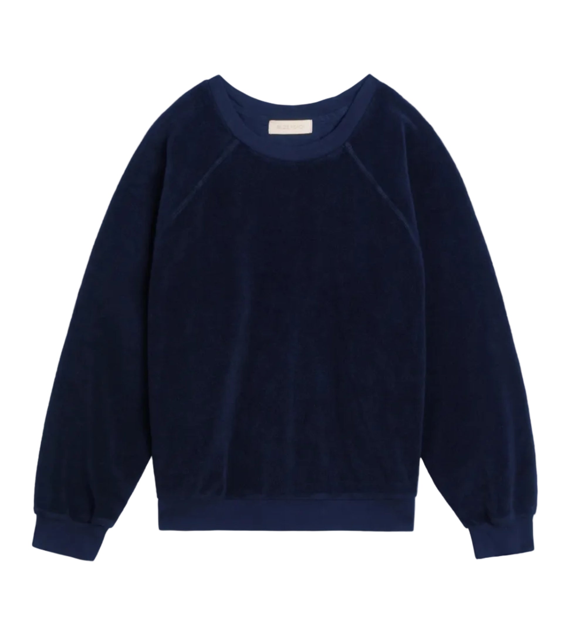The Suzie Kondi Samos Sweatshirt is a navy blue long-sleeve crewneck with comfy sleeves, ribbed cuffs and hem, and a relaxed fit, shown flat on a white background—ideal for travel or lounging.