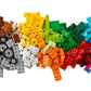 The LEGO® Classic Medium Creative Brick Box by Legos - Toyhouse features colorful bricks in a gradient from brown, gray, yellow, green, red, blue to purple on a white background, inspiring creativity and imaginative play.