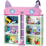 A vibrant, multi-level toy house with cat-like roof ears mimics LEGO® Gabby's Dollhouse. Each room includes a sliding elevator, detailed with furniture and figures, exuding playful and cozy vibes. From Legos - Toyhouse brand.