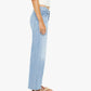 A person wearing a white sleeveless top, tan sandals, and Mother’s Mid Rise Rambler Zip Ankle Fray jeans stands in profile against a plain white background.
