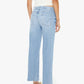 A woman is shown from the back wearing Mother’s Mid Rise Rambler Zip Ankle Fray jeans in light blue with a wide straight leg and frayed hem, paired with a white sleeveless top and sandals against a plain background.