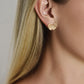 Anabel Aram Butterfly Stud Earrings crafted from gold, worn on an earlobe.
