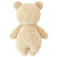 The Cuddle + Kind Baby Boucle Bear - Honey is shown from the back, highlighting its curly beige texture and soft Peruvian cotton yarn with visible head, ears, arms, and legs against a white background.