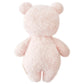 The Baby Boucle Bear - Strawberry by Cuddle + Kind is a fluffy, light pink teddy bear plush, hand-knit from heirloom-quality Peruvian cotton yarn, shown from the back with round ears and limbs against a plain white background.