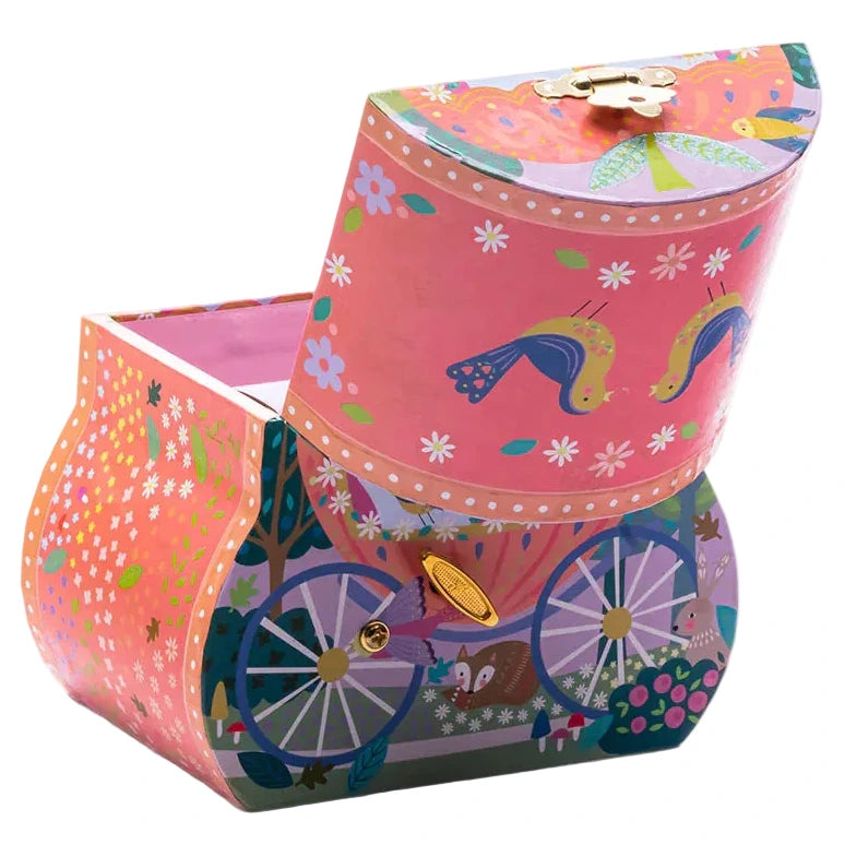 Introducing the Fairy Tale Carriage Jewelry Box from Floss and Rock—a charming pink decorative jewelry box, partially open and beautifully adorned with painted birds, flowers, and carriage wheels. Perfect for any little princess, this delightful musical jewelry box captures the magic of a fairy tale!.