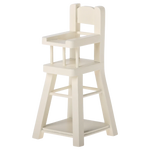 The Maileg High Chair - Micro is a small, white wooden chair with a backrest, armrests, and footrest—perfectly sized for micro bunnies or other Micro-sized Maileg friends.