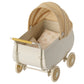 The Maileg Yellow Pram - Micro is a charming, vintage-style cream-colored toy baby carriage featuring a yellow plaid canopy and matching bedding—perfect for adding character to your dollhouse or for carrying micro-sized bunnies on delightful adventures.