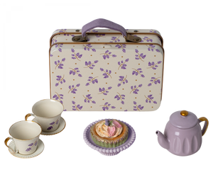 A Maileg Purple Madelaine Afternoon Treat tea set with cupcakes and a suitcase.