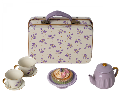 A Maileg Purple Madelaine Afternoon Treat tea set with cupcakes and a suitcase.