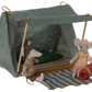 Two toy mice in sweaters sit outside the Maileg "Happy Camper Tent." One mouse holds a sleeping bag, while inside, a striped mat and extra-soft blanket on a padded bottom await, perfect for cozy nights.