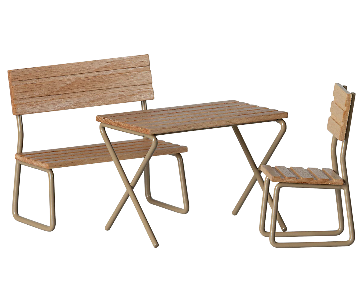 Transform your outdoor space with the Maileg Garden Set, Mouse—featuring a small table, a backrest bench, and a chair with sturdy metal frames and wood slats. Ideal for relaxing or entertaining your mouse family.