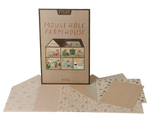The Maileg "Wallpaper, Mouse Hole Farmhouse" play set features a charming house illustration on the box, with patterned paper sheets and room stickers displayed in front.