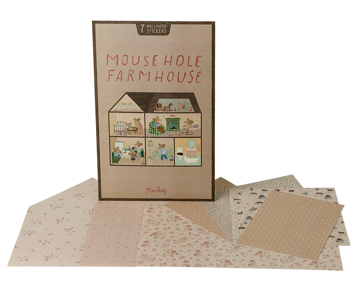 The Maileg "Wallpaper, Mouse Hole Farmhouse" play set features a charming house illustration on the box, with patterned paper sheets and room stickers displayed in front.