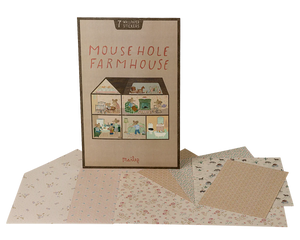 The Maileg "Wallpaper, Mouse Hole Farmhouse" play set features a charming house illustration on the box, with patterned paper sheets and room stickers displayed in front.