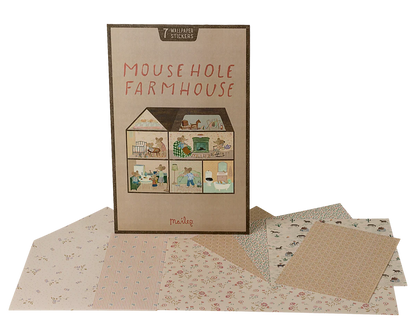 The Maileg "Wallpaper, Mouse Hole Farmhouse" play set features a charming house illustration on the box, with patterned paper sheets and room stickers displayed in front.