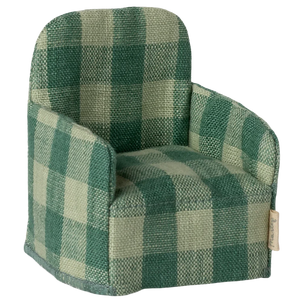 The Maileg Folding Chair, Mouse – Green Check features a green checkered upholstery in Mouse hole Farmhouse style with a tag on the bottom right side.
