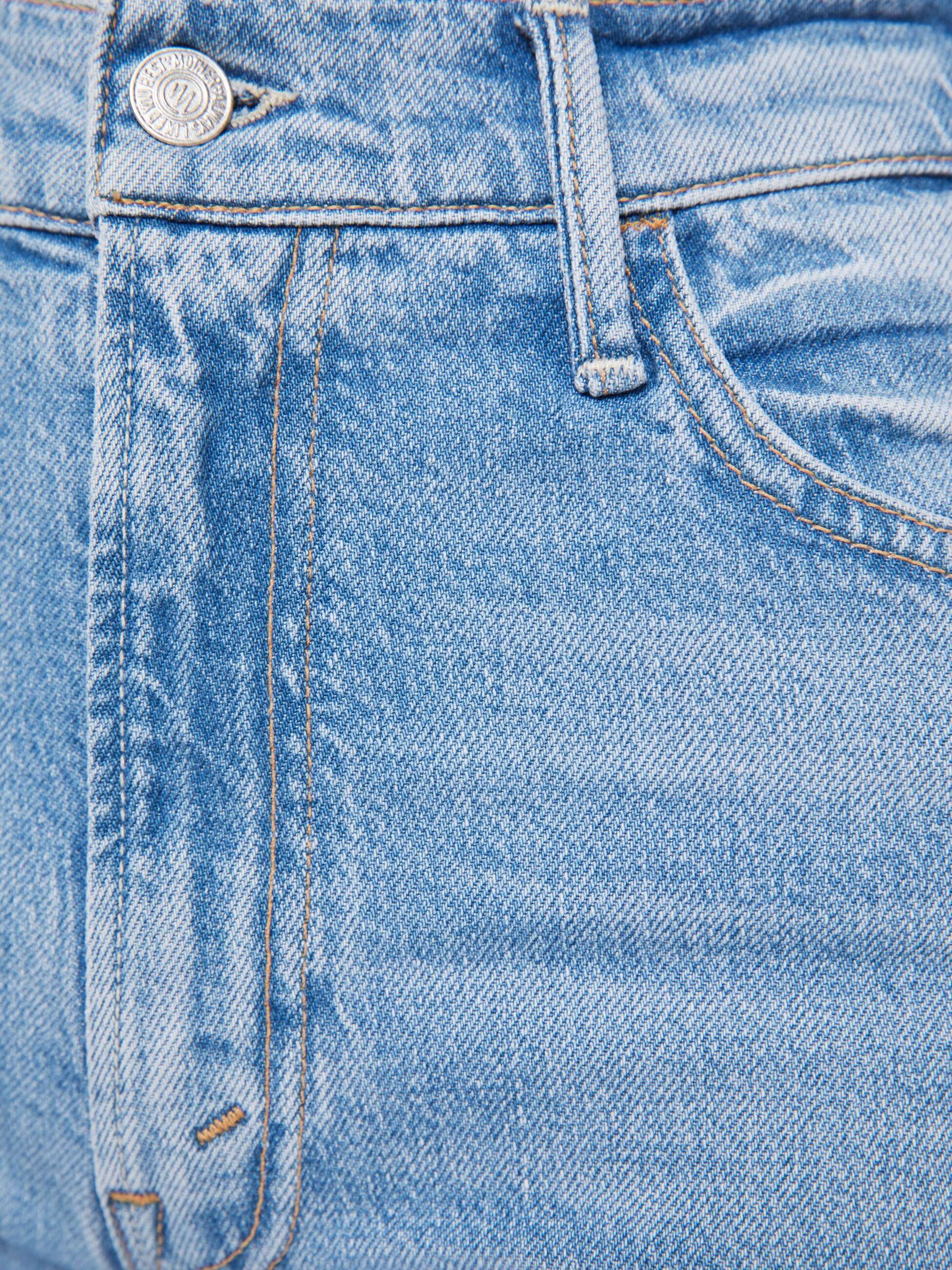 Close-up of The Hustler Ankle Fray jeans by Mother, highlighting the front pocket, belt loop, zipper fly, and metal button on these stylish high-waisted flared jeans with an ankle-length inseam.