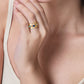 Anabel Aram Milos Multicolor Ring featuring a wide 18K gold plated band with a row of inlaid round turquoise, blue, and white stones worn on a hand.