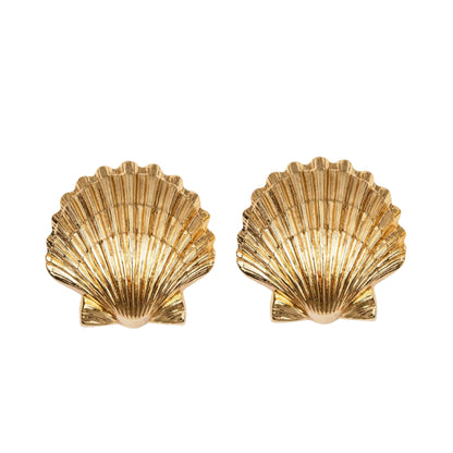 The Mar Earrings by Jennifer Behr, handmade in New York, feature golden scallop shells and are shown against a white background.
