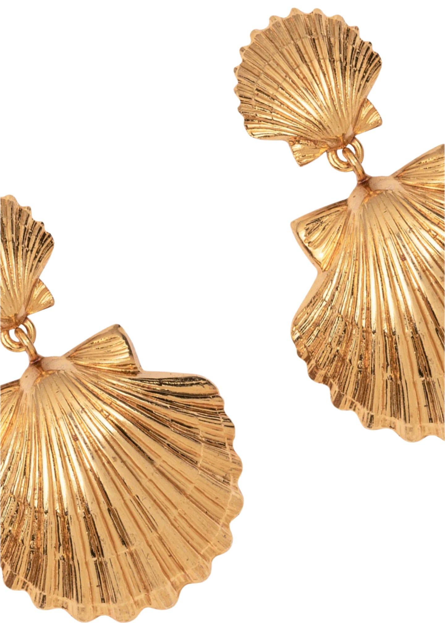 Close-up of two Jennifer Behr Caspian Earrings—shell-shaped with ridged, textured surfaces and a luminous 18-karat gold-plated finish—displayed on a white background.