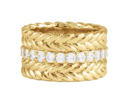 The Cheval Chain Stack Ring by Anabel Aram is a wide 18k gold ring with a braided design and a central row of round white pavé crystals set in a straight line.