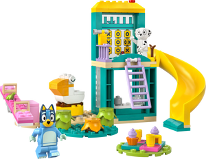 LEGO® Playground Fun with Bluey and Chloe by Legos - Toyhouse is a colorful preschool playset featuring a small building, slide, ladder, two animal figures, tea set, cupcakes, beds, and a duck-shaped toy.