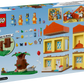 Back of LEGO® Bluey's Family House by Legos - Toyhouse box displays the assembled playset with Bluey minifigures, furniture, accessories, a tree, and a step-by-step building guide.