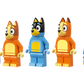 Four dog-like Lego figures from the LEGO® Bluey's Family House set by Legos - Toyhouse are lined up in a row, with two small accessory pieces on the right, all displayed on a white background.