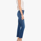 A woman stands in profile against a white background, wearing a short-sleeve white shirt, gray high-heeled shoes, and the Mother The Insider Ankle Step Fray high-waisted bootcut blue cropped jeans with frayed hems made from stretch denim.