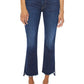 Model wears The Insider Crop Step Fray jeans by Mother, featuring dark blue stretch denim, a frayed step-hem, and cropped flare style, paired with clear embellished pointed-toe heels against a white background.