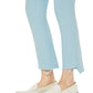 Person wearing the Mother Denim The Insider Crop Step Fray and white loafers, standing against a plain background.