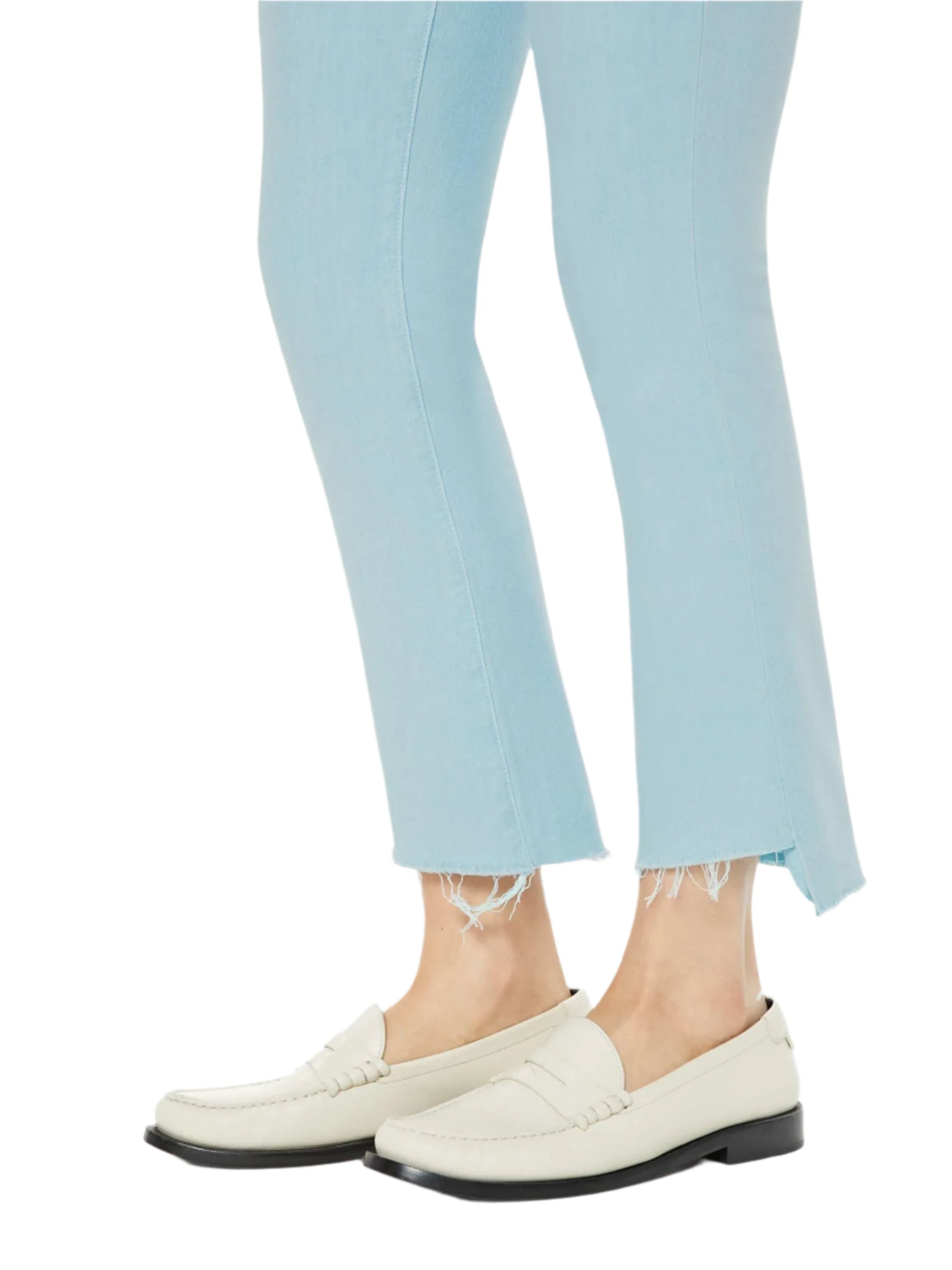 Person wearing the Mother Denim The Insider Crop Step Fray and white loafers, standing against a plain background.